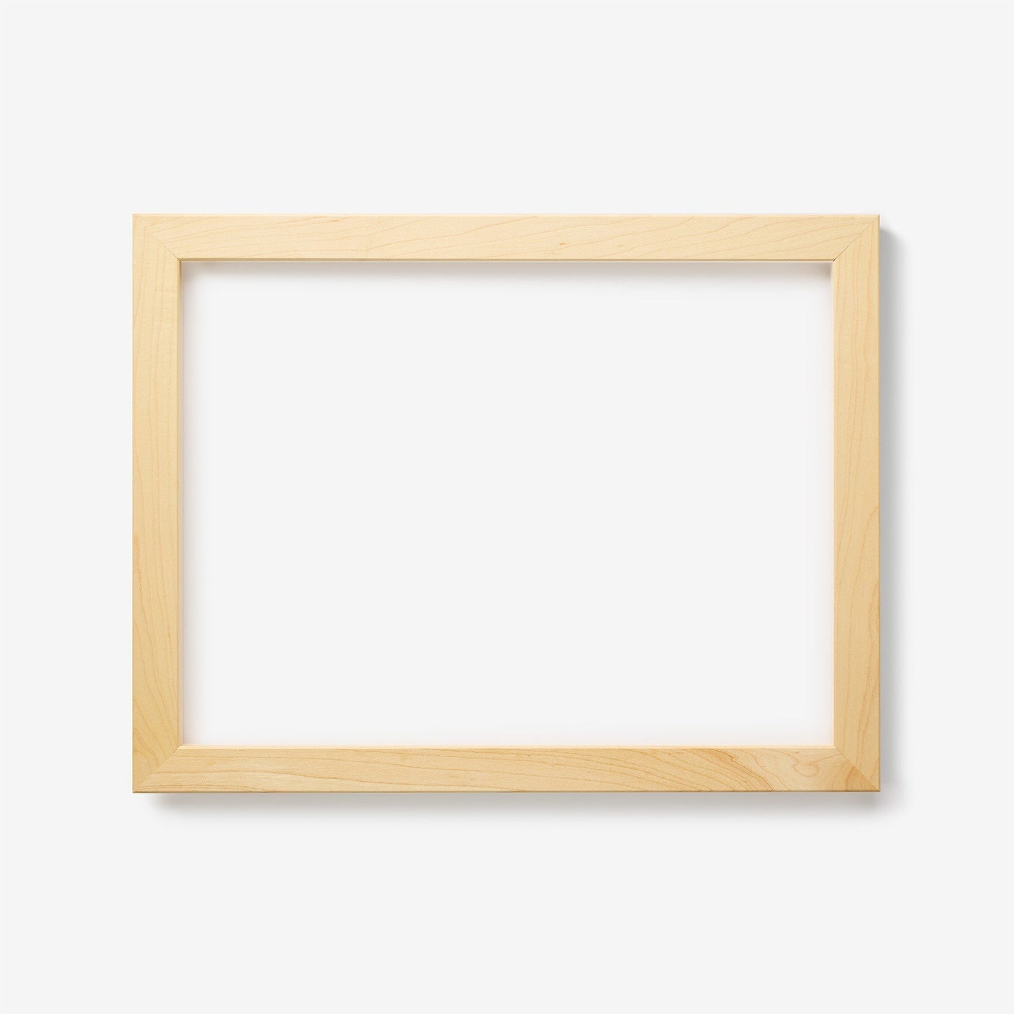 A medium rectangular maple wood frame on a white background