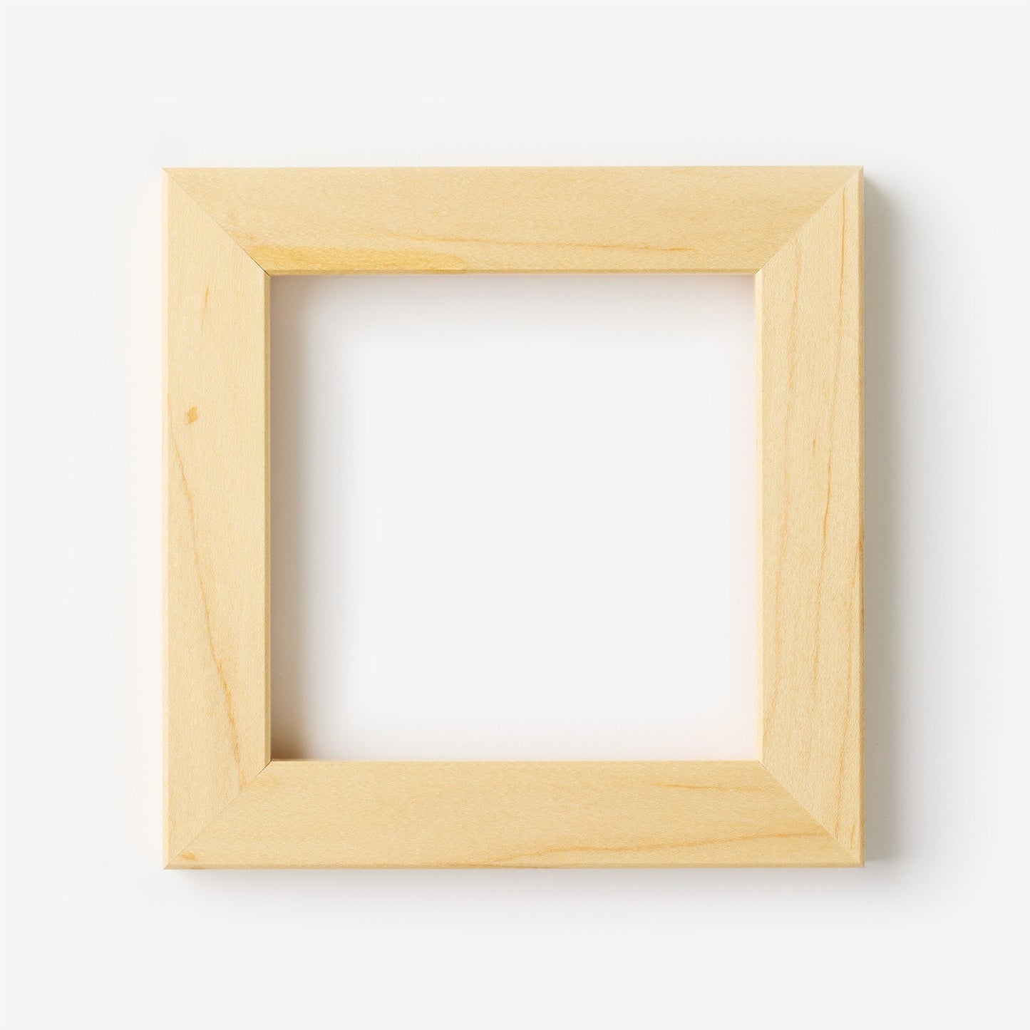 A small square maple wood frame on a white background