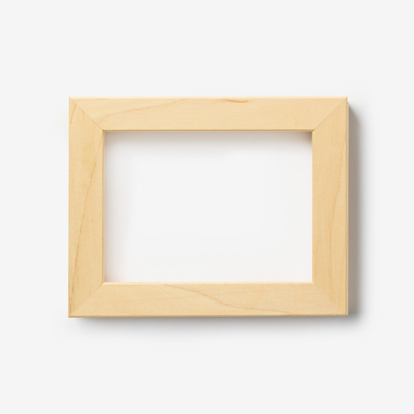 An extra small rectangular maple wood frame on a white background