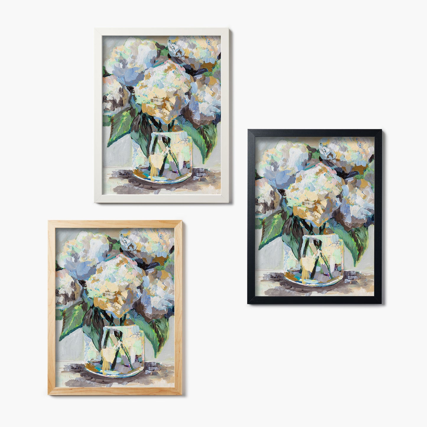 Three framed glass prints of a painting of hydrangea bouquets on a white background