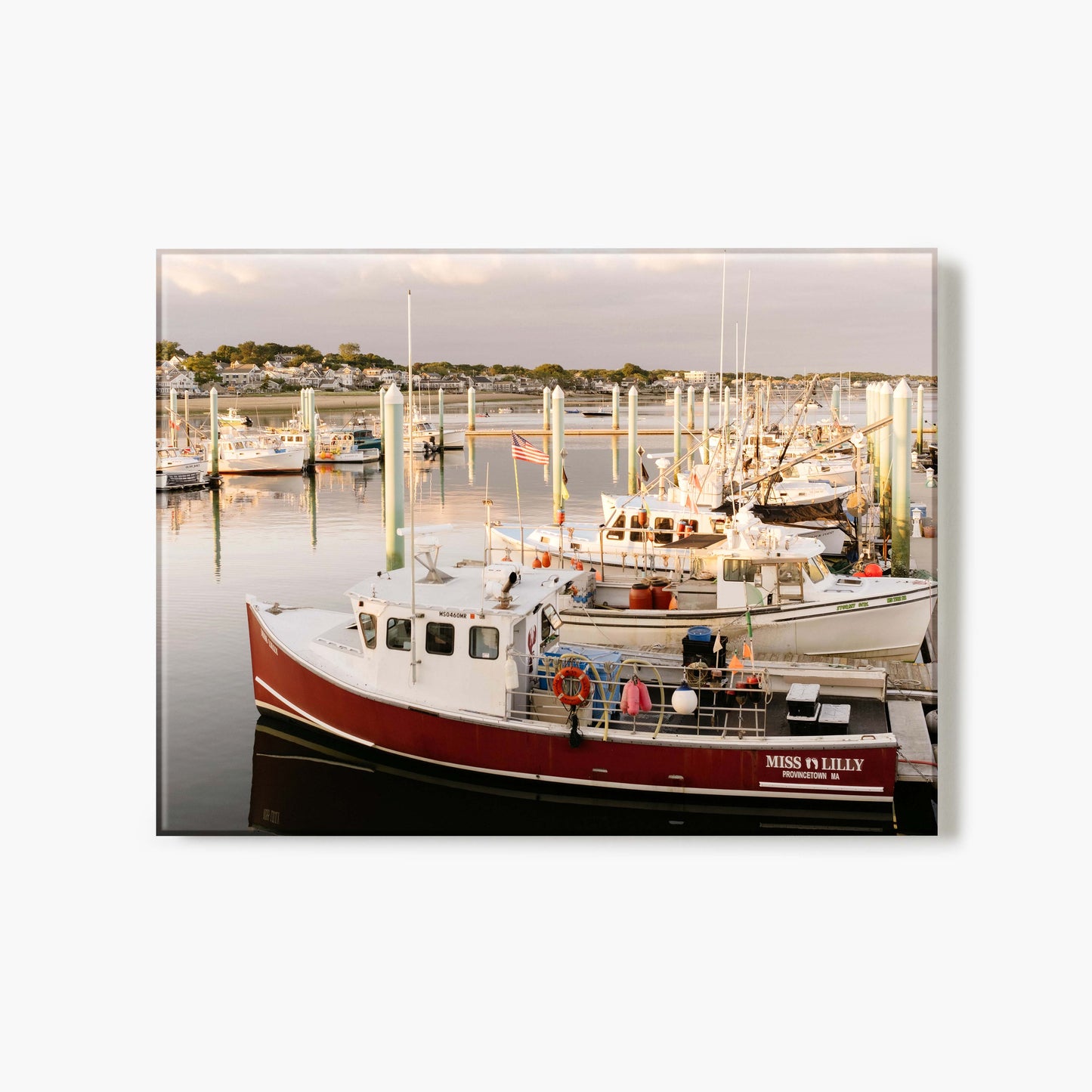 Glass print of a marina scene with boats docked at a harbor during sunset.
