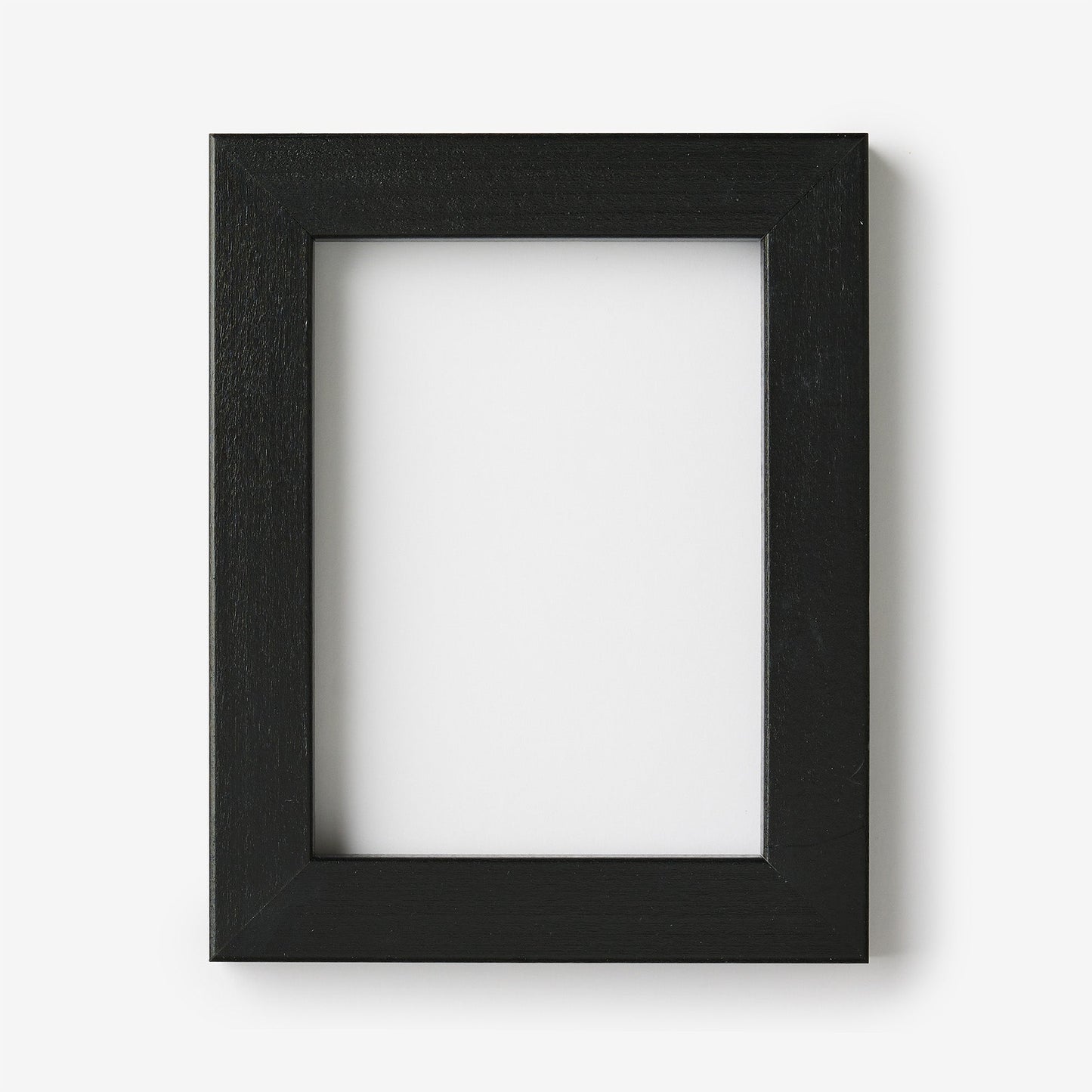 An extra small rectangular black wood frame on a white background