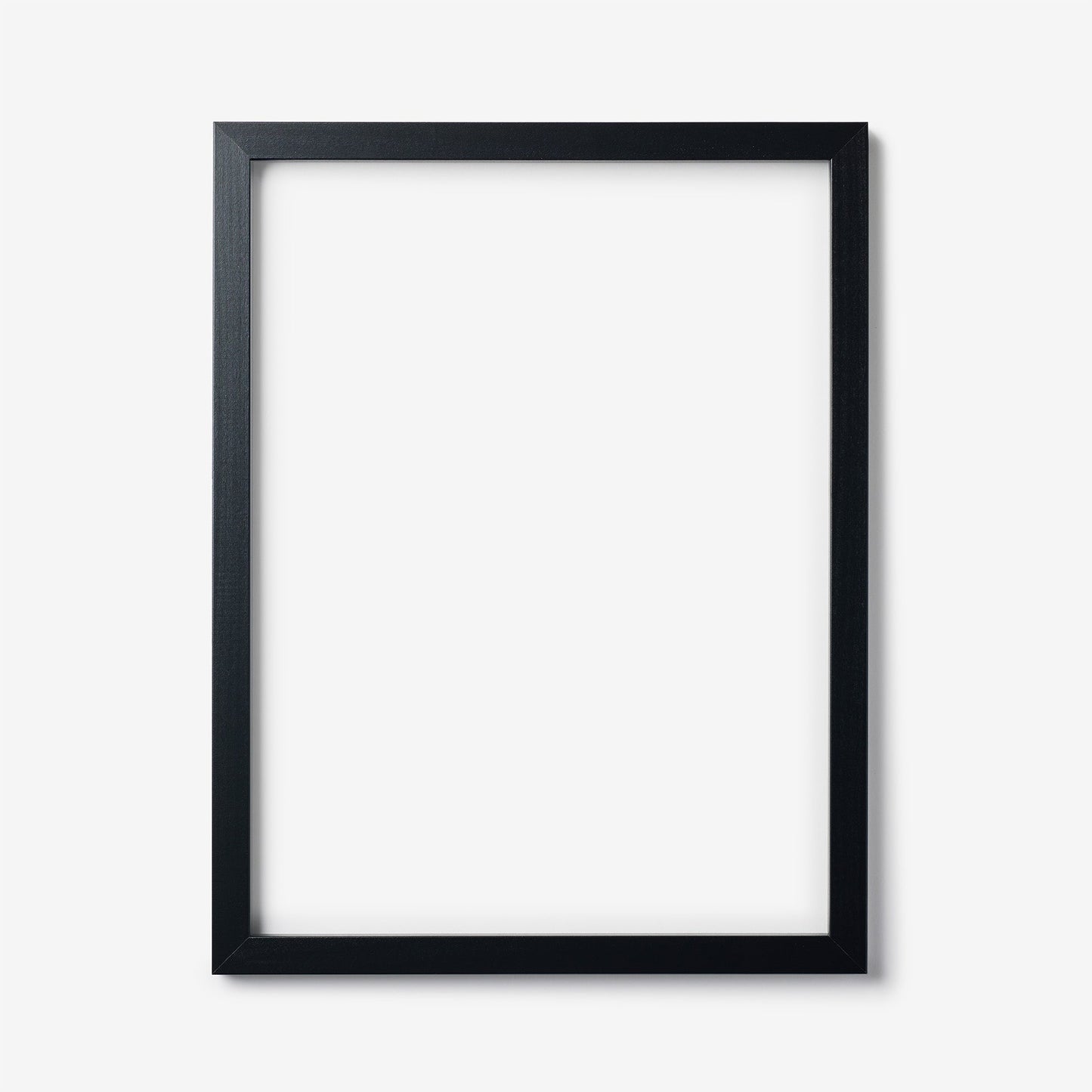 A large rectangular black wood frame on a white background