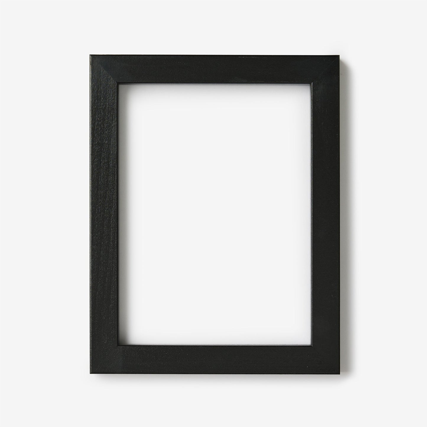 A small rectangular black wood frame on a white background