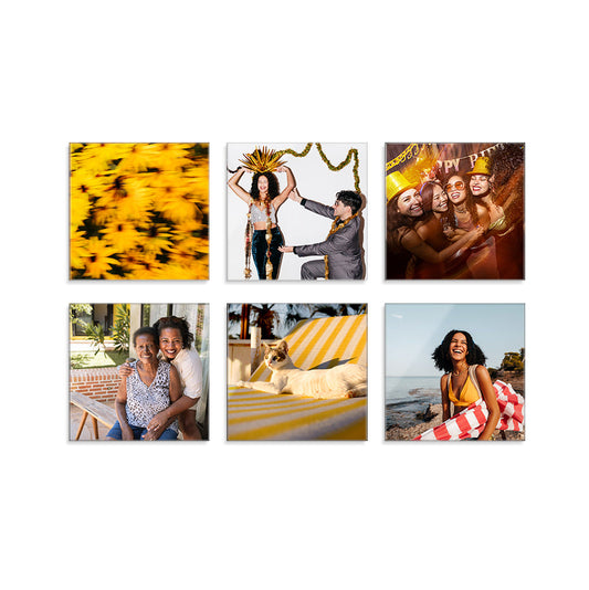Bundle set of six square glass prints featuring various subjects and settings, from a cat on a sun lounger to a NYE photobooth snapshot, on a white background.